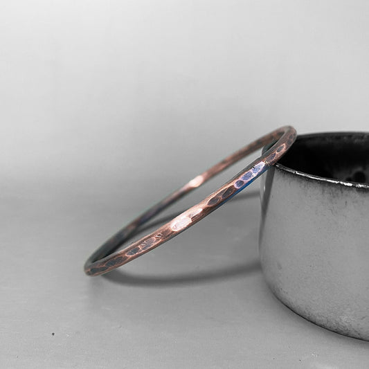 textured and oxidised copper bangle by MaisyPlum