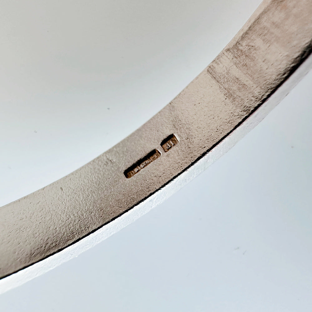 close up of hallmark on silver on a white background