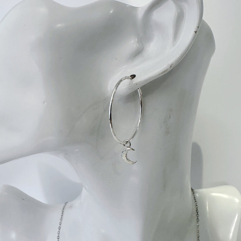 Model wearing MaisyPlum silver moon hoop earrings celestial style