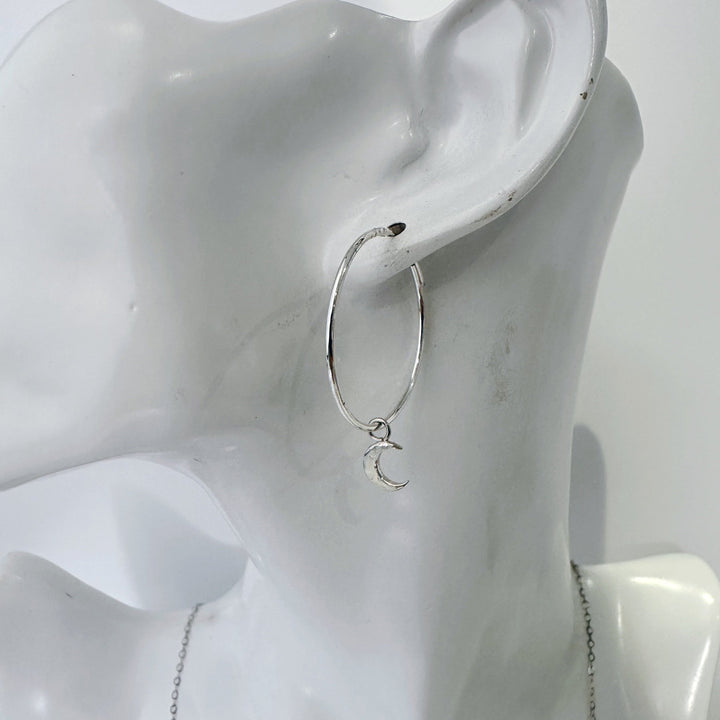 Model wearing MaisyPlum silver moon hoop earrings celestial style