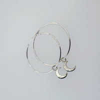Handmade sterling silver moon hoop earrings with crescent charms